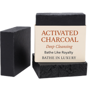 Two activated charcoal bars of soap with a label on a white background
