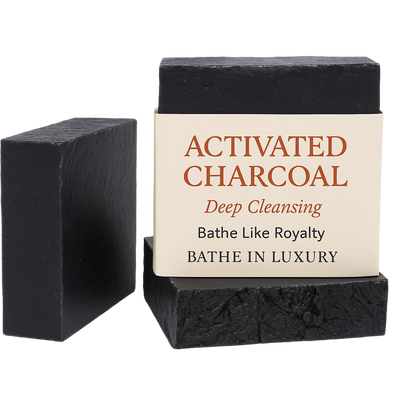 Two activated charcoal bars of soap with a label on a white background