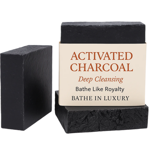 Two activated charcoal bars of soap with a label on a white background