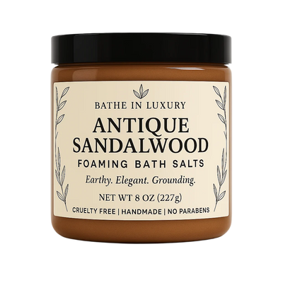Jar of Antique Sandalwood foaming bath salts with a black lid on a white background