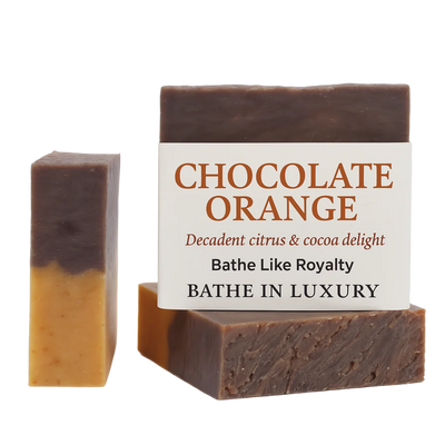 Two bars of chocolate orange soap with a descriptive label on a white background