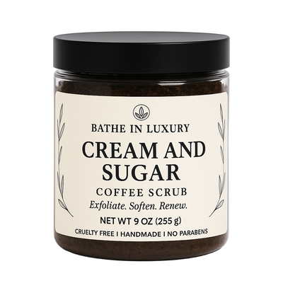 Jar of Cream and Sugar Coffee Scrub with a black lid on a white background