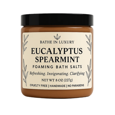 Jar of Eucalyptus Spearmint Foaming Bath Salts with a black lid on a white background