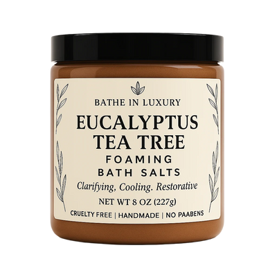 Jar of Eucalyptus Tea Tree Foaming Bath Salts with a black lid on a white background