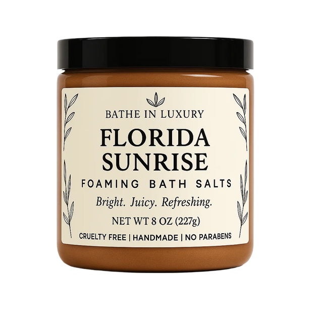 Jar of 'Florida Sunrise' foaming bath salts with a black lid on a white background