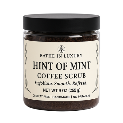Jar of Hint of Mint Coffee Scrub with a black lid on a white background