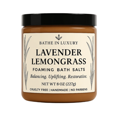 Jar of Lavender Lemongrass foaming bath salts with a black lid on a white background