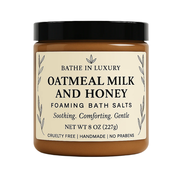 Jar of oatmeal milk and honey foaming bath salts with a black lid on a white background.