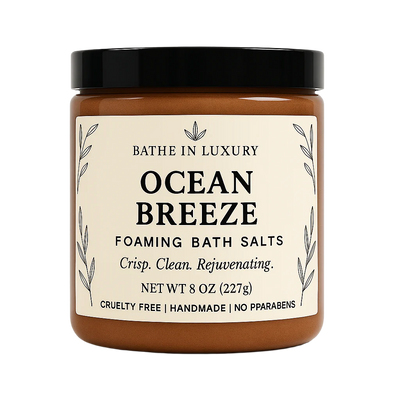 Jar of 'Ocean Breeze' foaming bath salts with a black lid on a white background