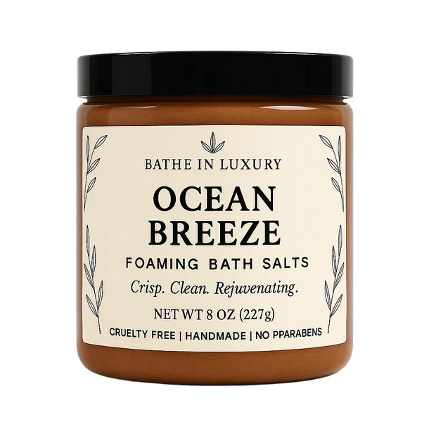 Jar of 'Ocean Breeze' foaming bath salts with a black lid on a white background