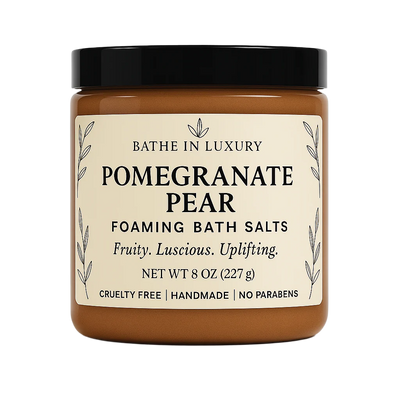 Jar of Pomegranate Pear foaming bath salts with a black lid on a white background