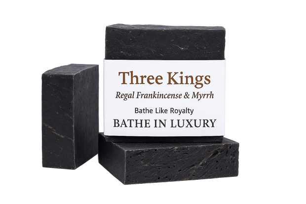 Two black soap bars with a 'Three Kings' label on a white background