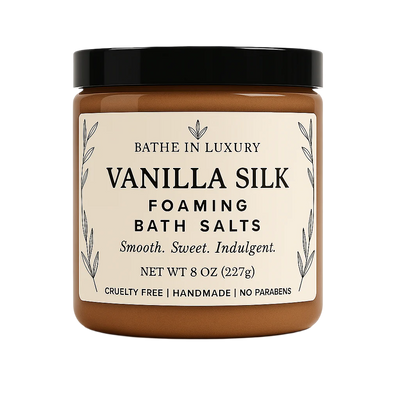 Jar of Vanilla Silk foaming bath salts with a black lid on a white background