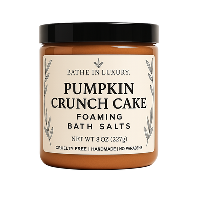 Jar of Pumpkin Crunch Cake foaming bath salts with a black lid on a white background